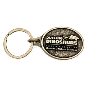 Dueling Dinosaurs Brass Keychain