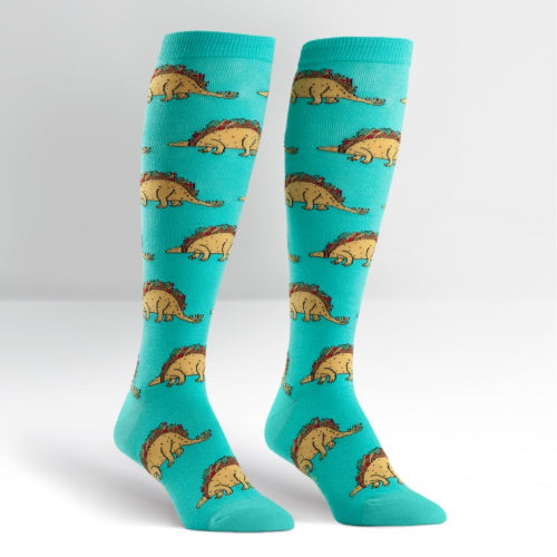 Turquoise knee socks with yellow taco shaped dinosaurs